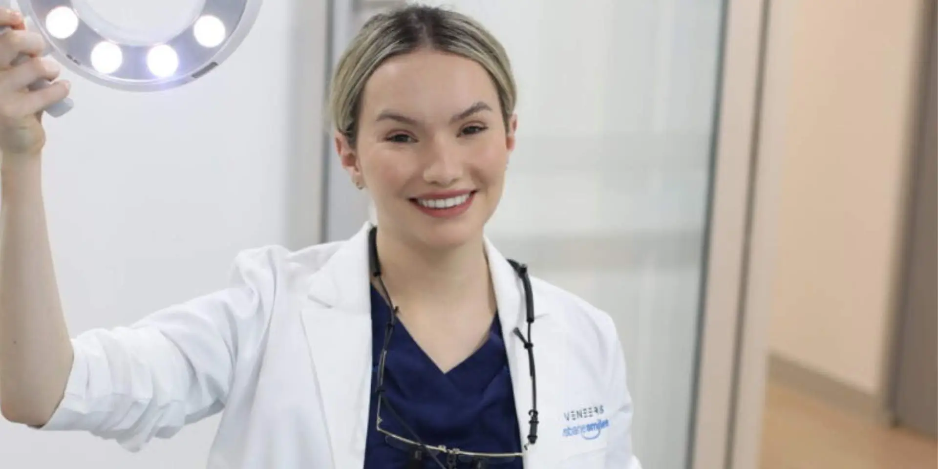 Blog brisbane smiles the science behind smiling female dentist